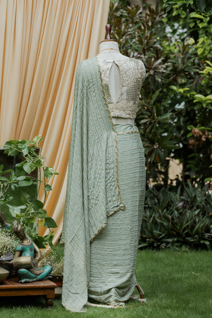 Sage green pipe work saree with matching blousepiece