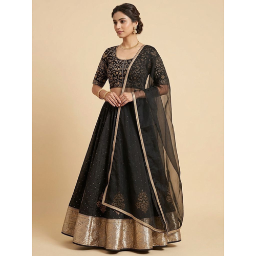Woman wearing a black embroidered traditional outfit with a beige background