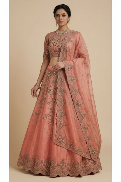 Peach-colored embroidered traditional outfit on a beige background