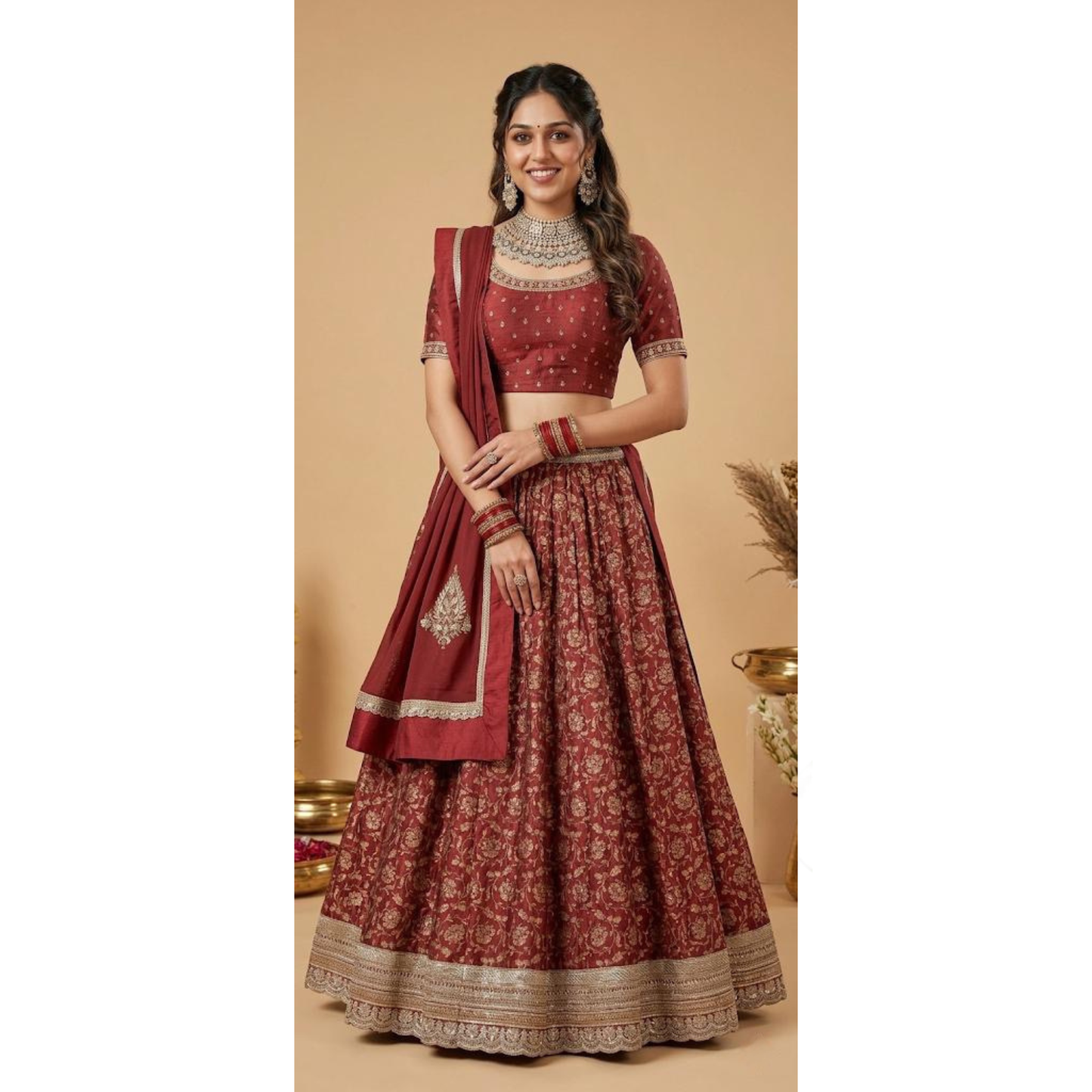 Woman wearing a traditional red and gold outfit with jewelry on a beige background