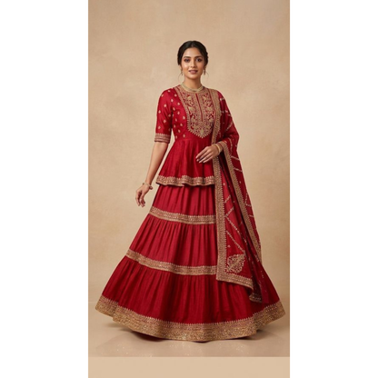 Red traditional outfit with gold embroidery on a beige background