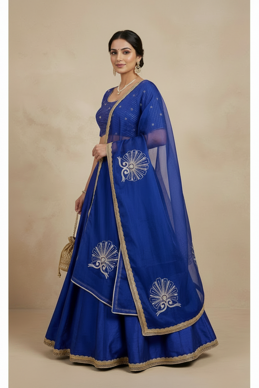 Woman wearing a blue embroidered traditional outfit with a beige background