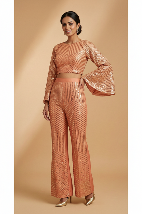 Woman wearing a bronze sequin outfit on a beige background