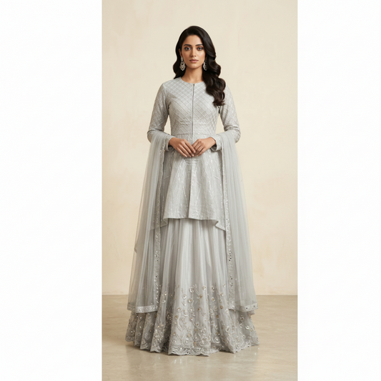 Woman wearing a silver embroidered traditional outfit on a beige background